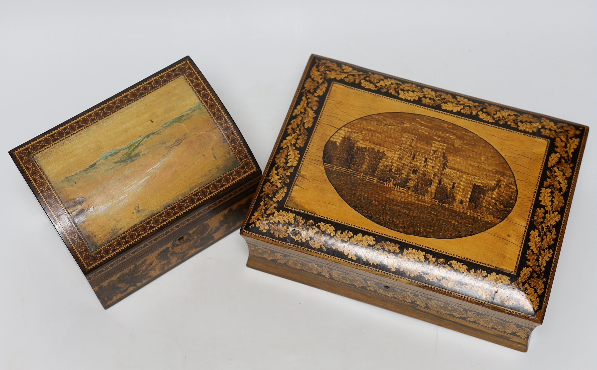 A Tunbridgeware rosewood games box with view of Bodiam Castle, a brush and a stationery box, largest 24cm wide, 18cms deep